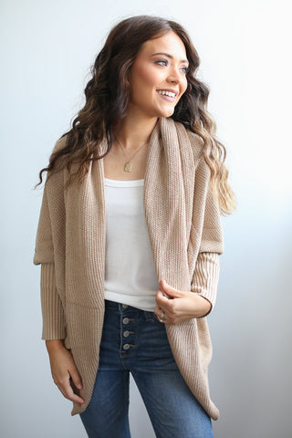 Long sleeve ribbed knit open front sweater cardigan with tapered fit sleeve. So flattering! 